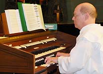 Trinitarian playing church organ.